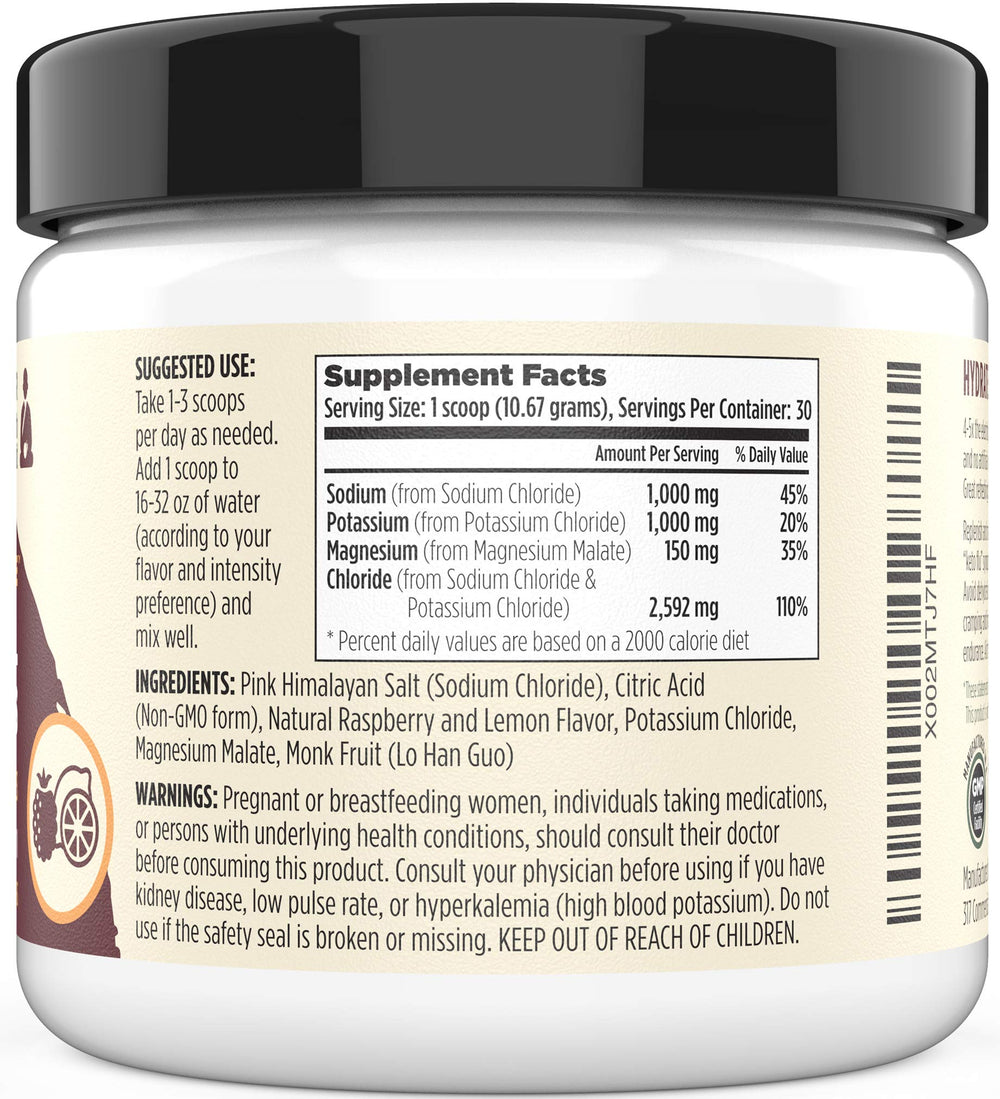 Sacred Eats Keto Electrolyte Powder Raspberry Lemon in a glass, showing flavor