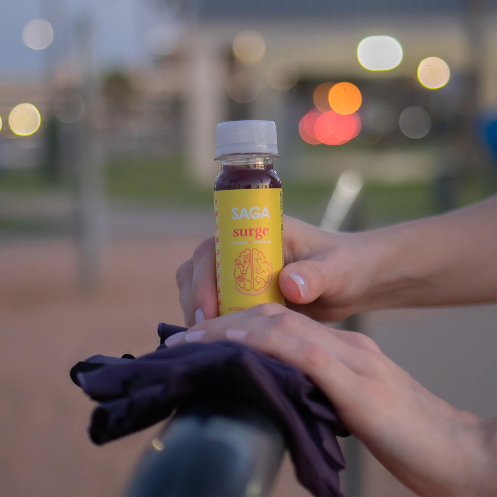 SAGA Surge peach mango shot side view in gym bag to boost endurance