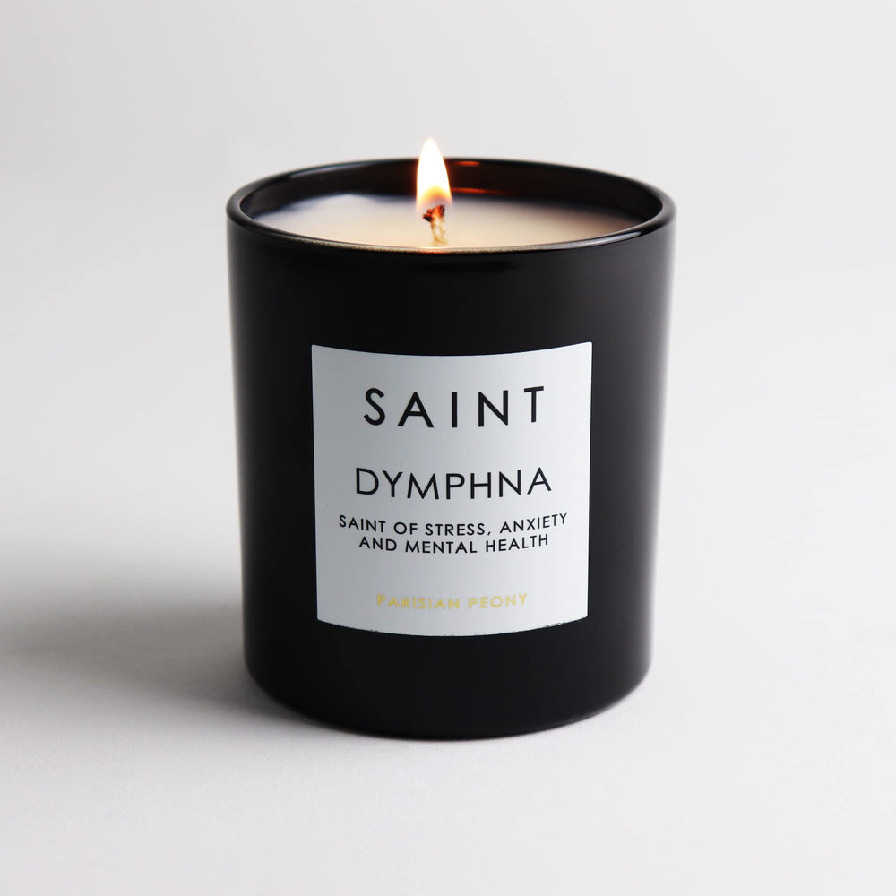 Saint Dymphna candle emits amber glow enhancing relaxation mood