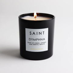 Saint Dymphna candle emits amber glow enhancing relaxation mood