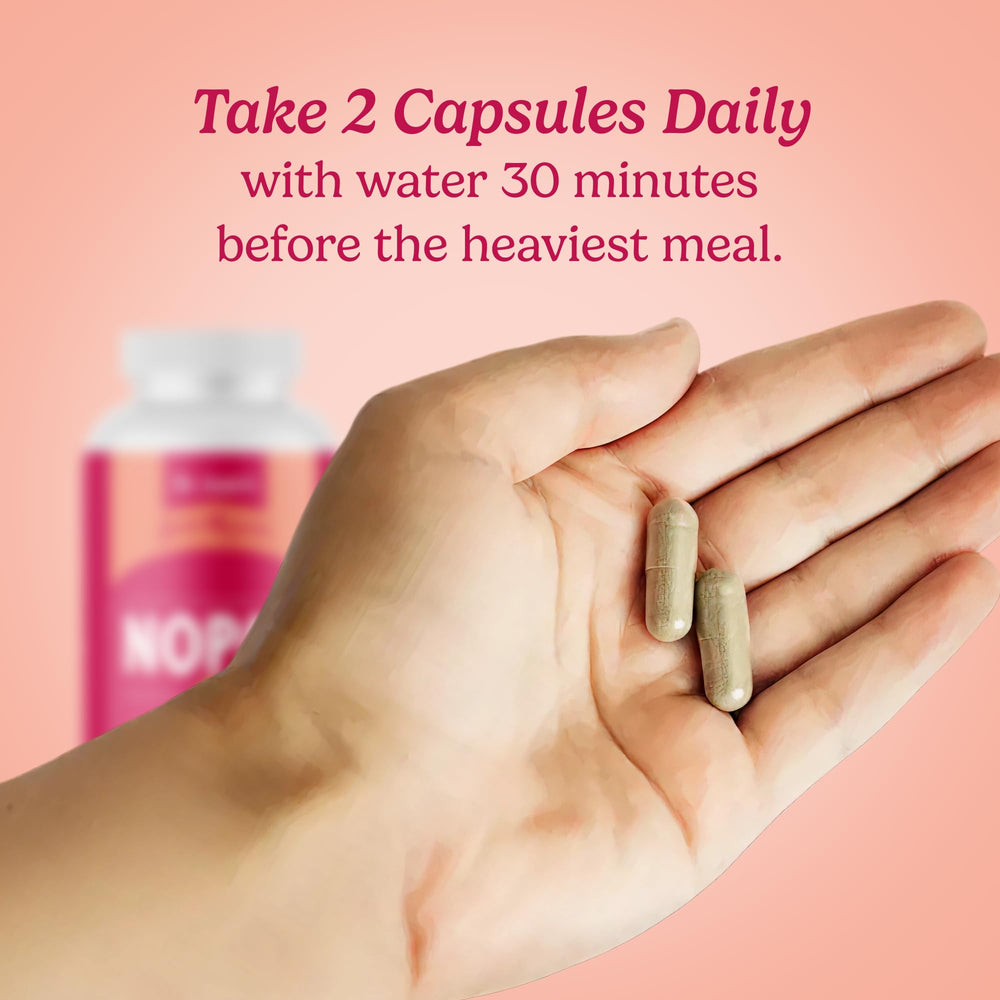 Adult taking Santo Remedio Nopal capsules with water before meals.