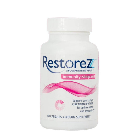 Savant Science RestoreZ Sleep capsules beside the bottle for a calm night routine.