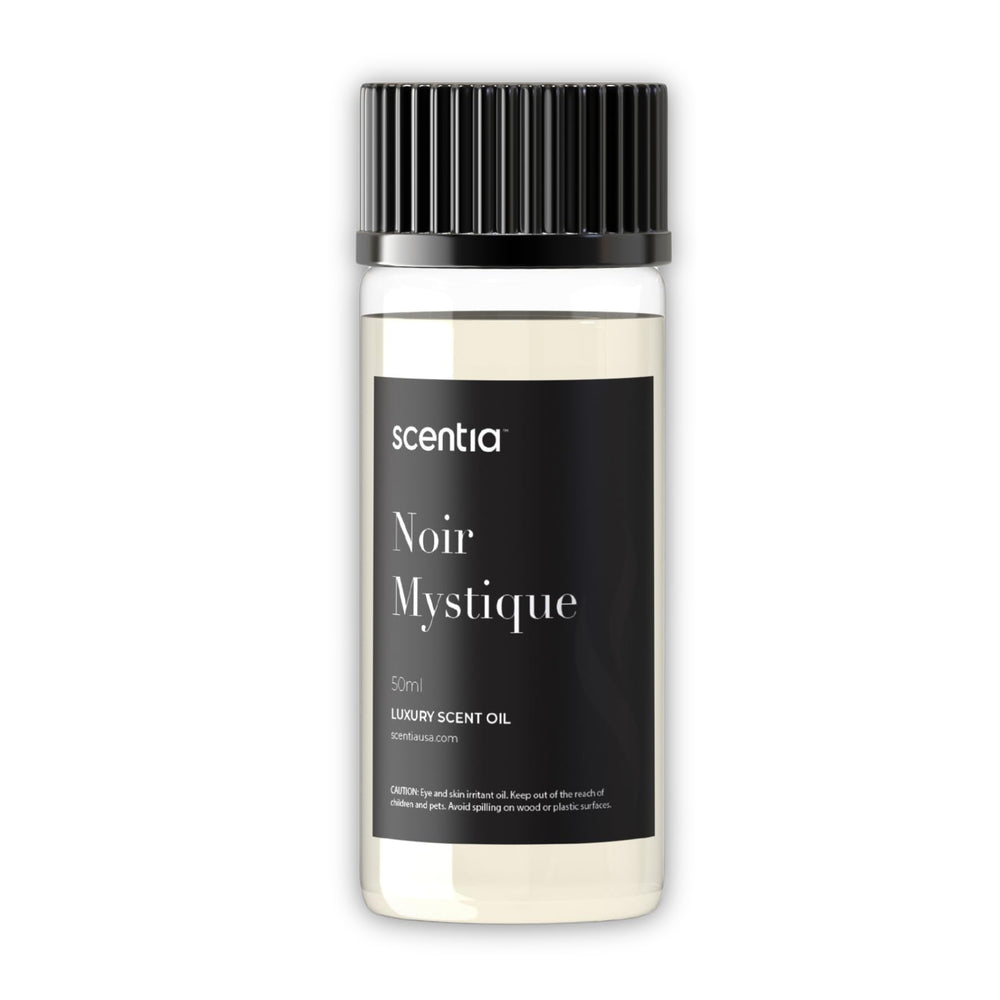 Scentia Noir Mystique bottle pour releases rose-lemon-musk notes for uplifting ambience