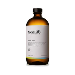 Close-up of Scentify 5th Ave oil bottle highlighting elderberry gardenia blend.