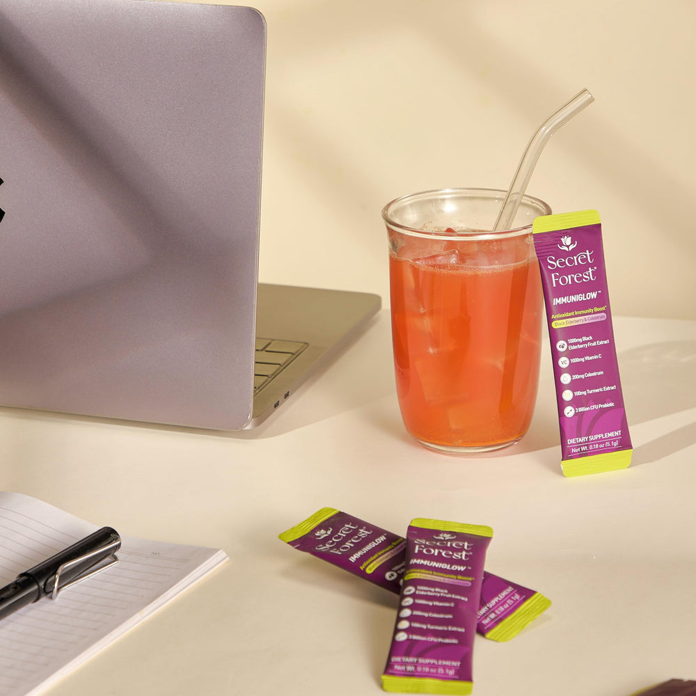 Berry flavor swirl in a glass of ImmuniGlow illustrating tasty daily ritual