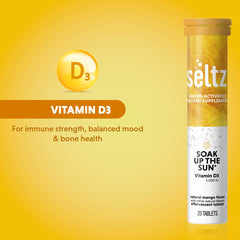 Packaging of Seltz Soak Up The Sun mango-orange flavor bottle showcased beside a glass.