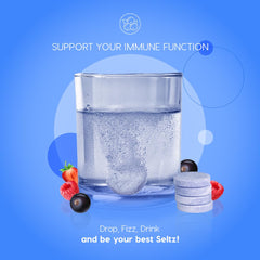 Seltz vitamin C and zinc fizzing in water.