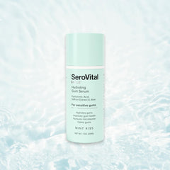 Applying Serovital Smile Gum Serum to gums as part of nightly routine