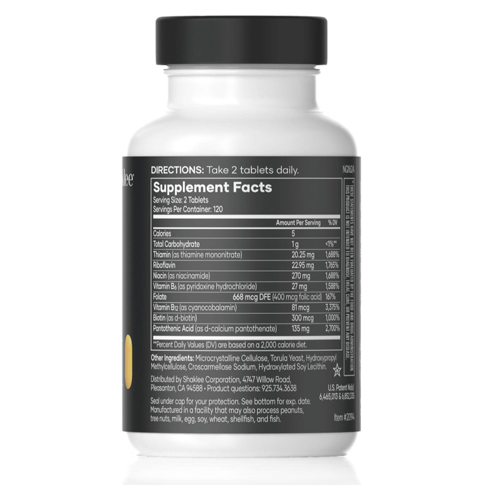Shaklee B-Complex tablets close-up highlighting compact daily supplement.