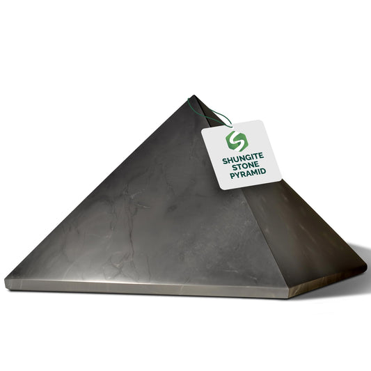 Shungite World authentic shungite pyramid 150mm on desk for protection and focus.