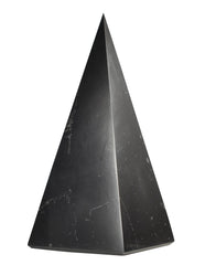 Shungite World authentic tall pyramid 60mm on desk for grounding and focus.
