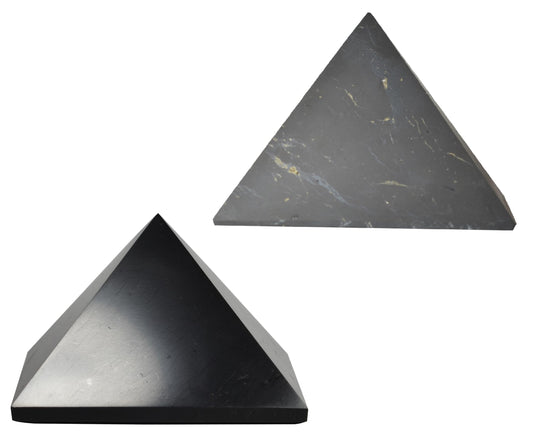 Shungite World 90mm polished pyramid on a desk for subtle energy balance.