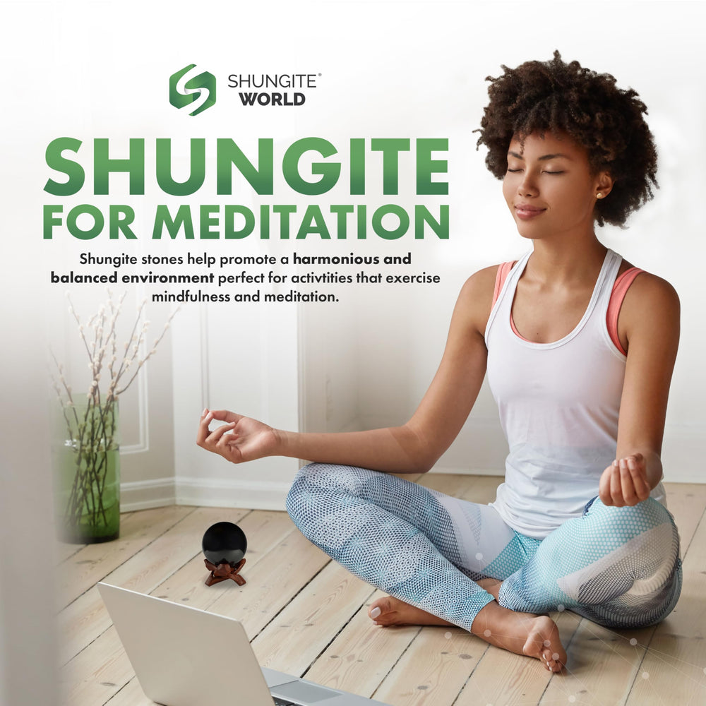 Shungite World sphere beside a laptop hinting at device-friendly grounding
