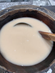 Prepared kava mix poured into a glass ready to enjoy.