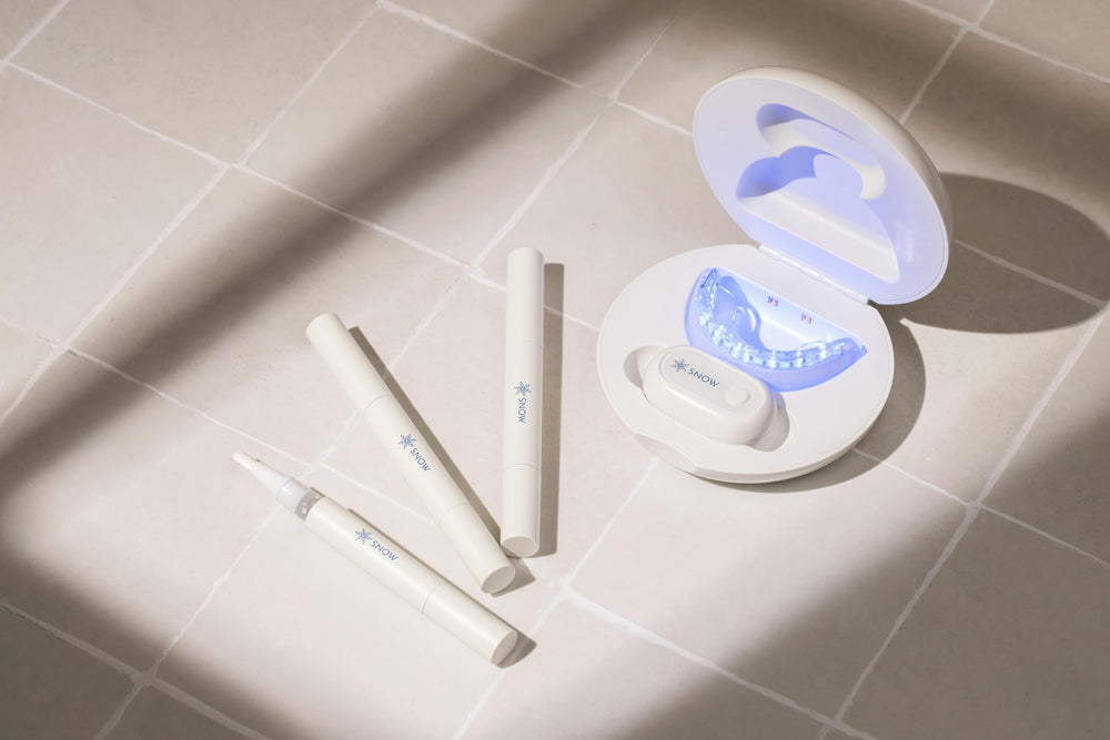 SNOW at-home dental care branding on the kit packaging.