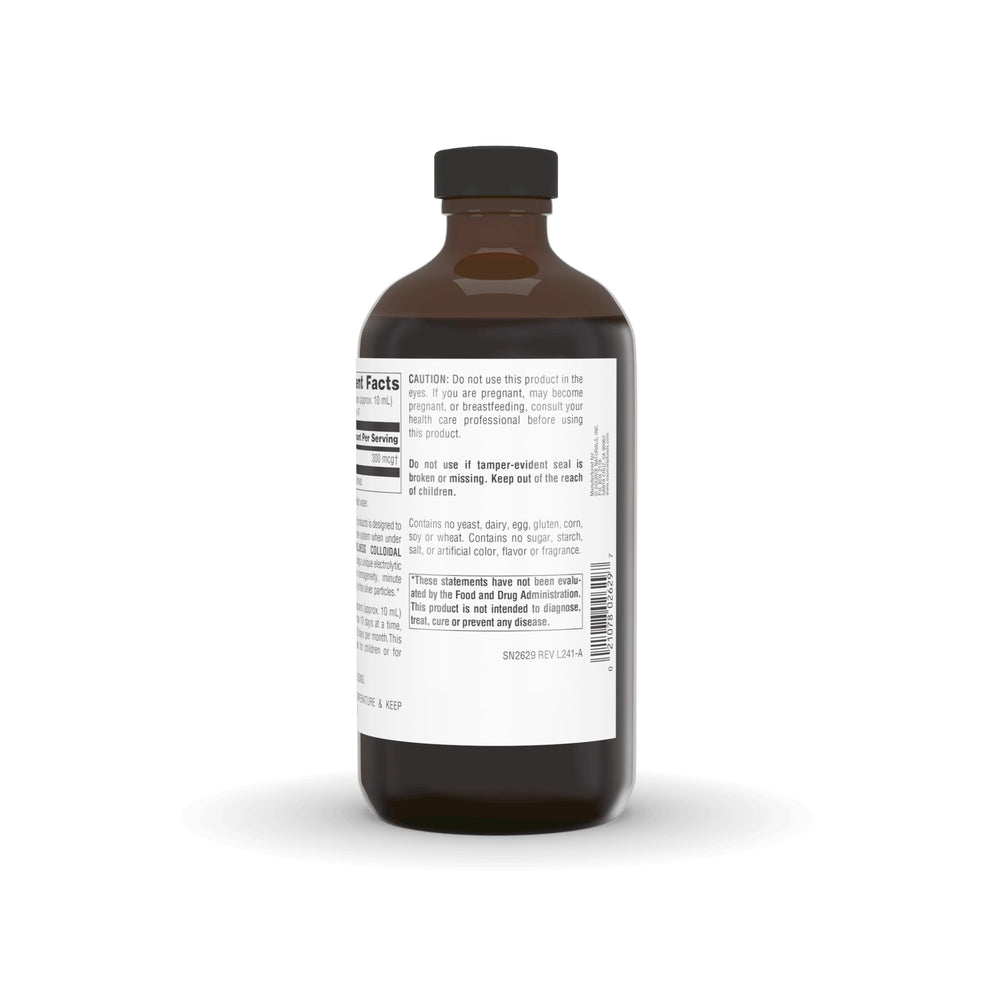 Measuring dosage with a spoon beside the Source Naturals bottle