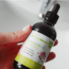 Organic ingredients like astragalus and raspberry leaf shown.