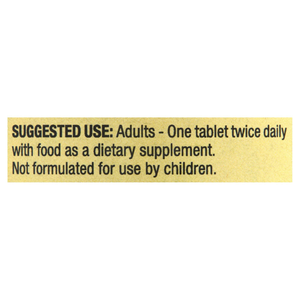 Spring Valley Calcium 600mg bottle with glass of water for easy intake.