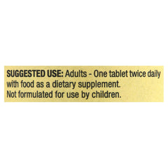 Spring Valley Calcium 600mg bottle with glass of water for easy intake.