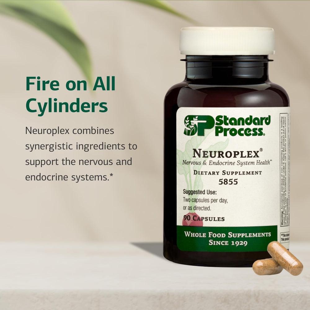 Neuroplex capsules close-up highlighting vitamins B6, iron, and zinc.