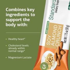 Standard Process StandardBar Soy Almond Crunch in hand, ideal for a quick on-the-go snack.