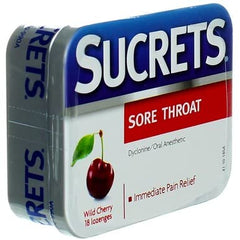 Lozenges placed on table beside glass suggest soothing daily use.