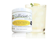 Sufficient-C Lemon Peach Drink Mix scoop beside the tub for quick portions