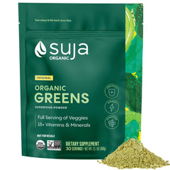 Suja Organic Greens Powder bag beside a glass, suggesting daily energy support.