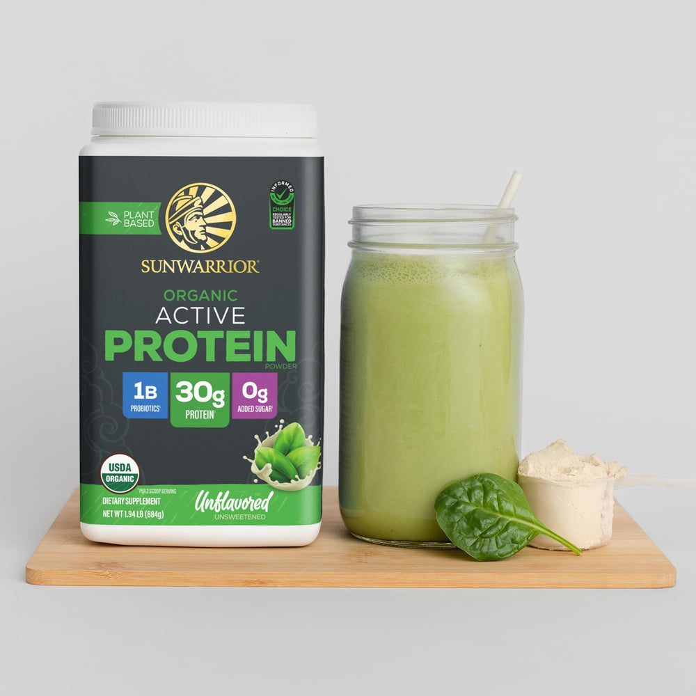 Sunwarrior unflavored protein powder in glass with scoop, versatile base for smoothies.