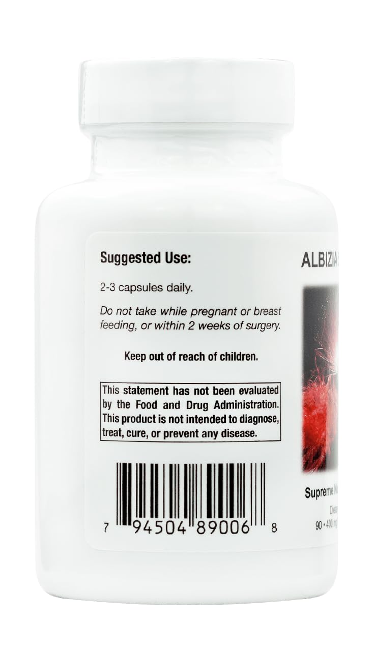 Close-up of Albizia Supreme capsules highlighting pure herbal composition