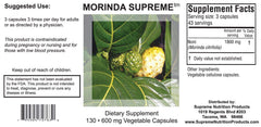 Morinda Supreme capsules being poured, illustrating easy daily use