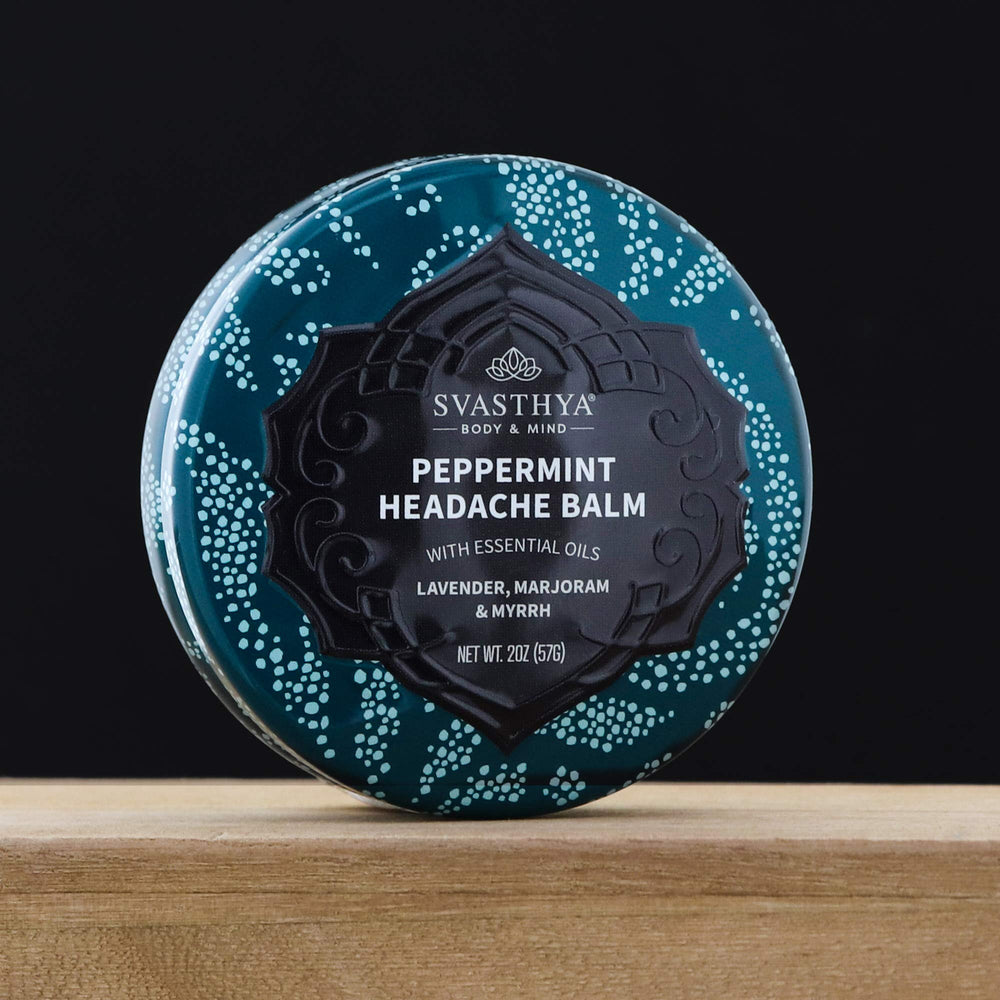 Svasthya Headache Balm applied to temples for a calming scent experience.