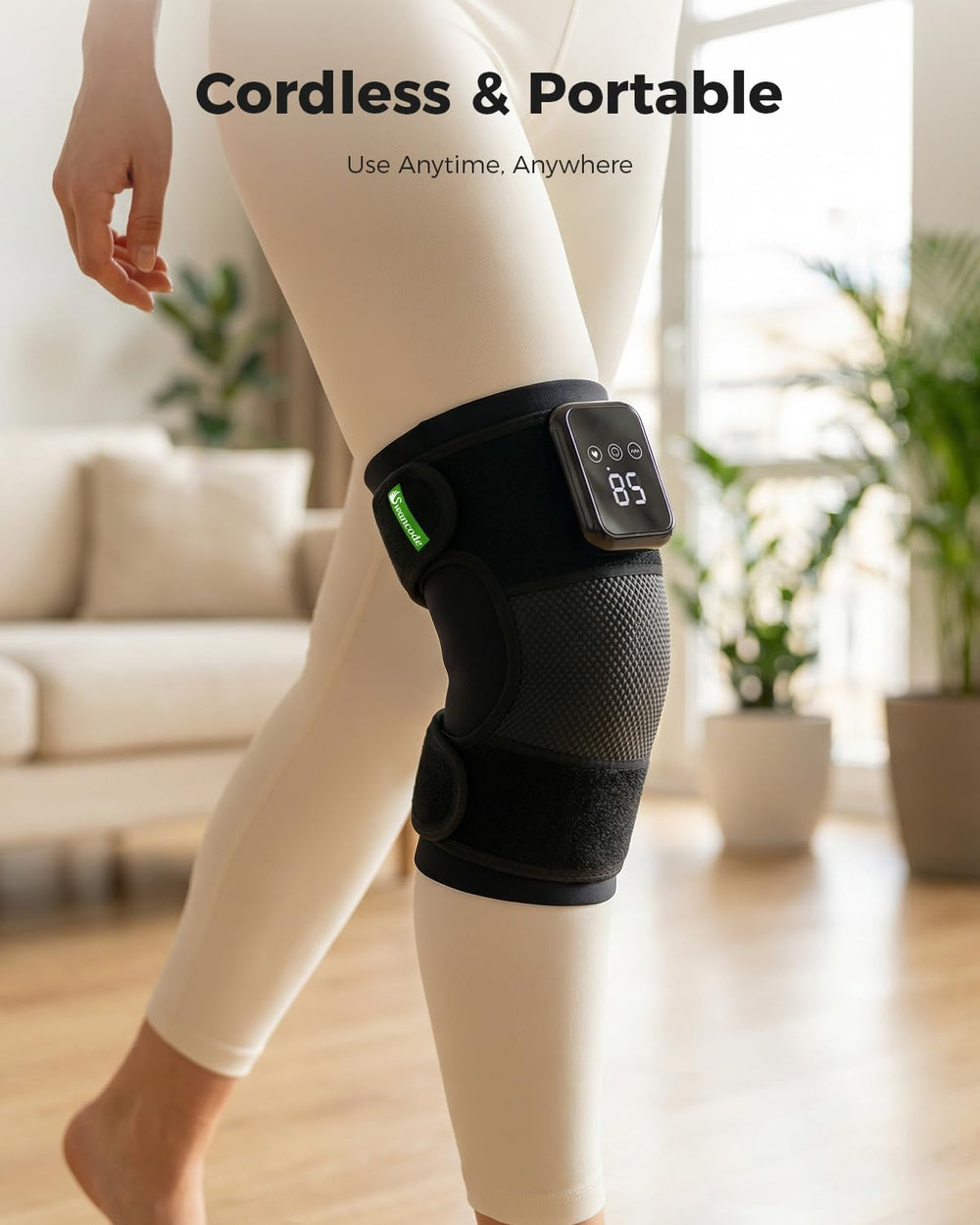 Swancode knee massager used on elbow with extension strap.