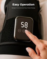 Swancode knee massager applied to shoulder to relax joints.