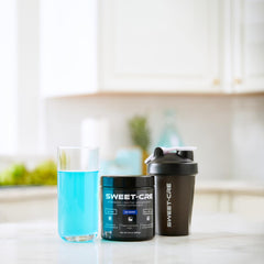 SweetCre micronized creatine powder with scoop for easy mixing.