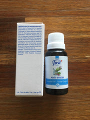 SwissJust Stress Relief bottle pour releasing soothing vapors for relaxation.