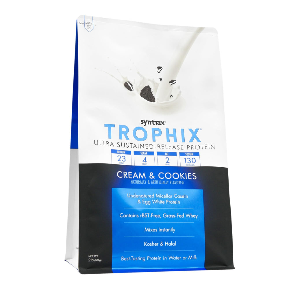 Syntrax Trophix shake pouring into glass showing smooth mixability and real cookie pieces