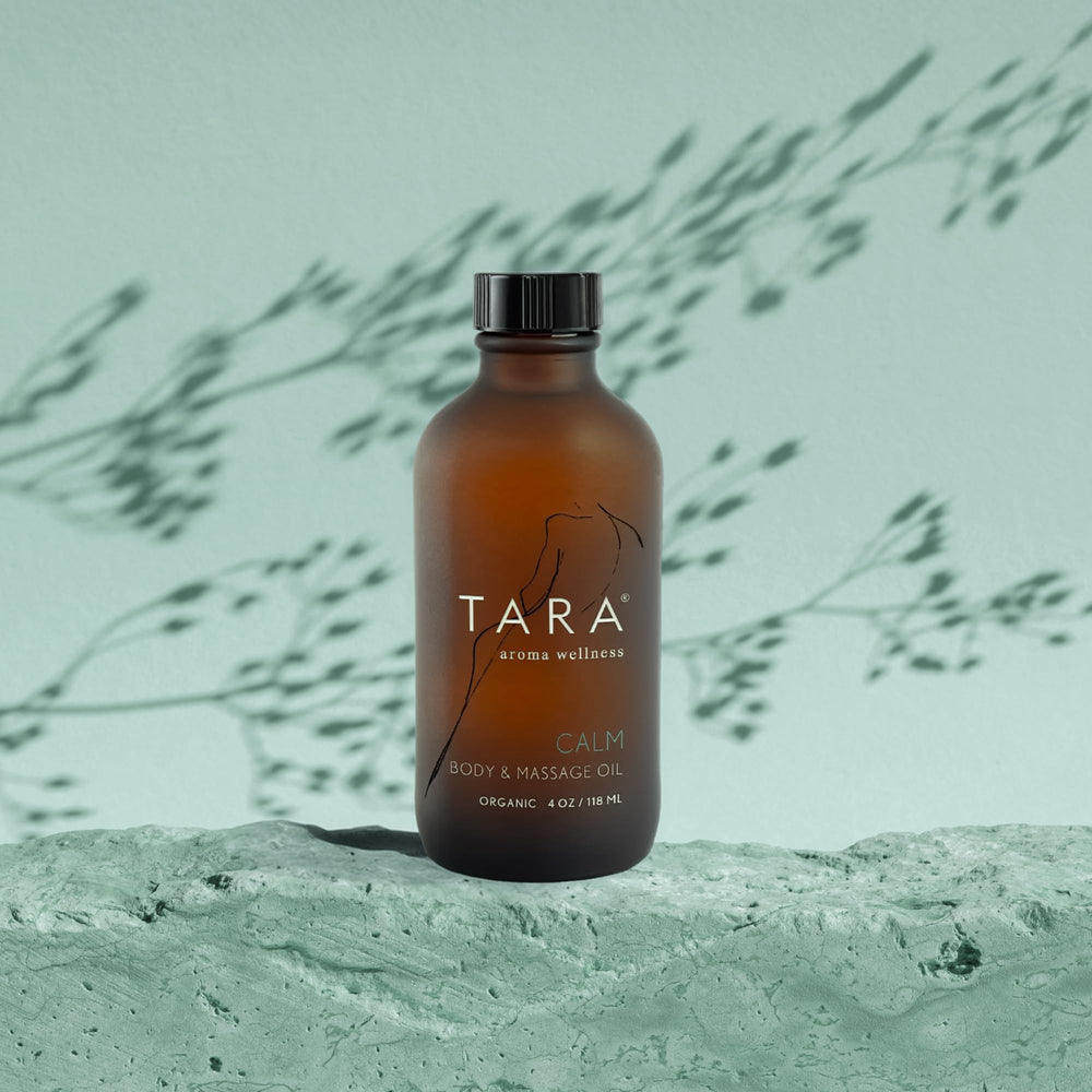 TARA Spa Therapy Calm bottle placed on towel for home spa ritual.