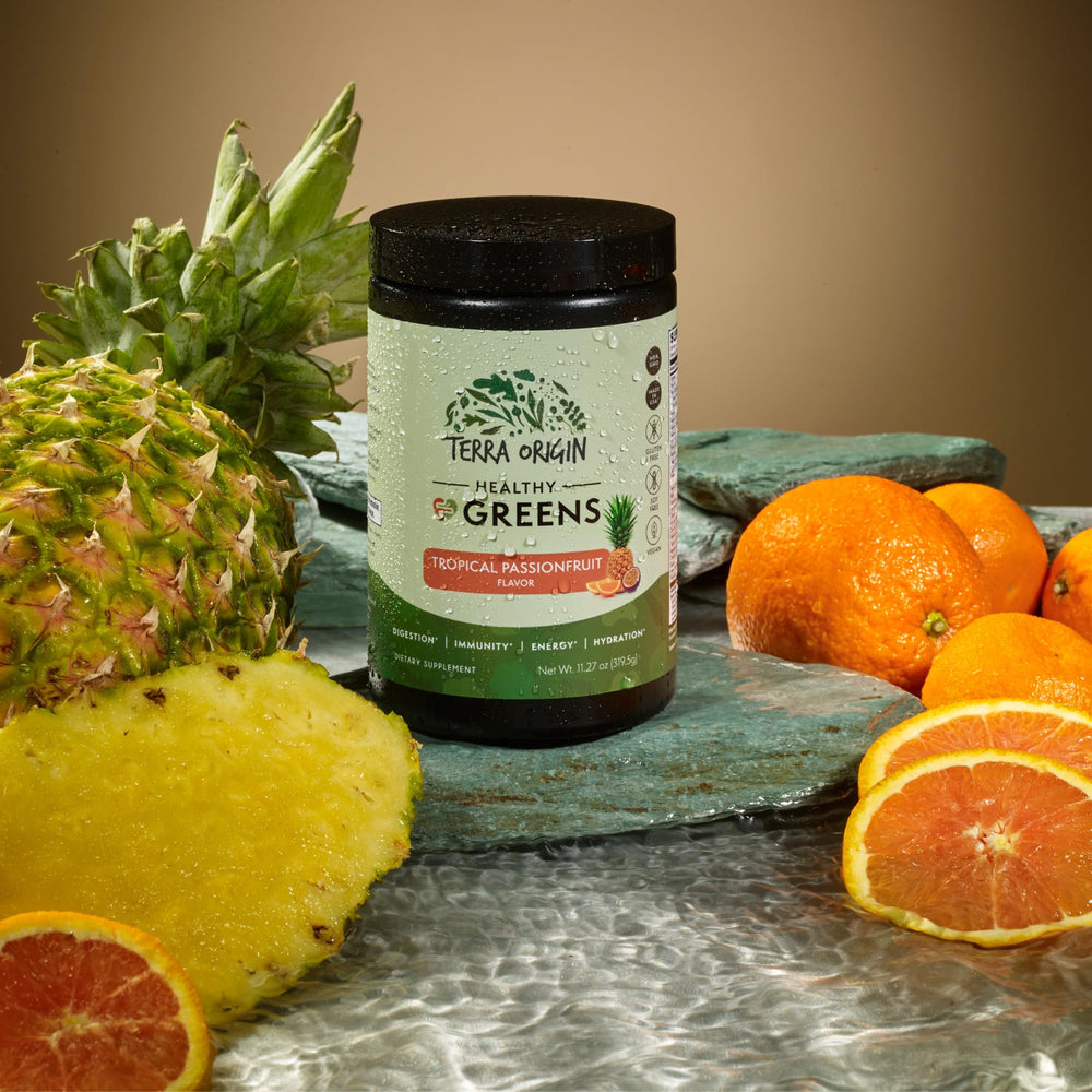 TERRA ORIGIN shaker pouring greens powder into a smoothie for digestion