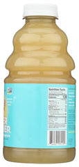 The Ginger People Gingerade is poured into a warm mug, suggesting comforting flavor.