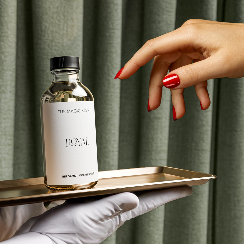 Diffuser in a room with candle nearby demonstrates a calm, lounge-worthy mood.