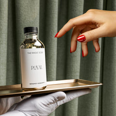 Diffuser in a room with candle nearby demonstrates a calm, lounge-worthy mood.