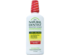 The Natural Dentist Healthy Gums Mouthwash bottle promotes fresh breath and gum support.