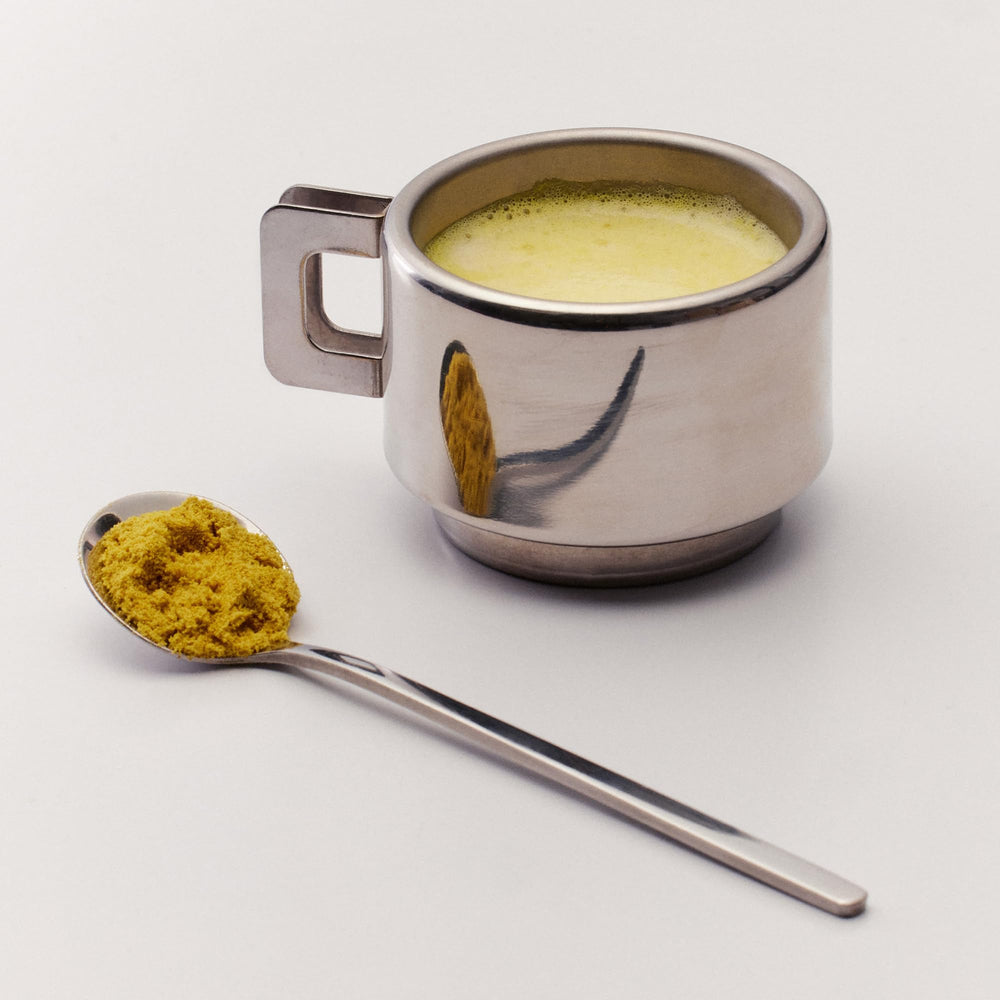 The Nue Co Debloat jar shown in a kitchen, ready for convenient daily use.