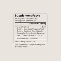 The Nue Co Defense Drops bottle side label shows vegan, alcohol-free formulation for mindful living.