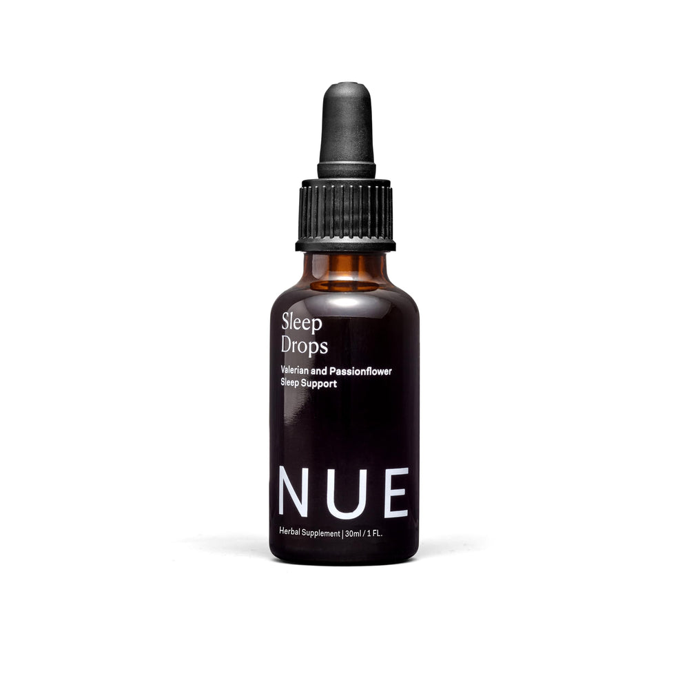 The Nue Co Sleep Drops bottle for a calm, simple bedtime routine.