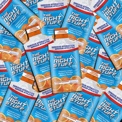 The Right Stuff Orange Tangerine powder dissolving in water for quick hydration.