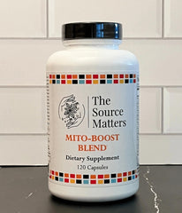 The Source Matters Mito-Boost scene with capsules and a glass of water