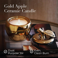 Thompson Ferrier apple candle jar lit emits a cozy glow.