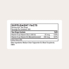 Thorne vitamin D3 and K2 liquid dispenser top showing precise drop dosing for consistency.